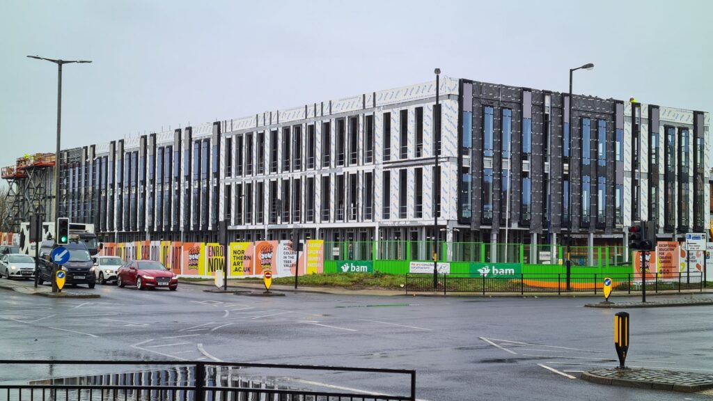 Modern office building under construction with street view