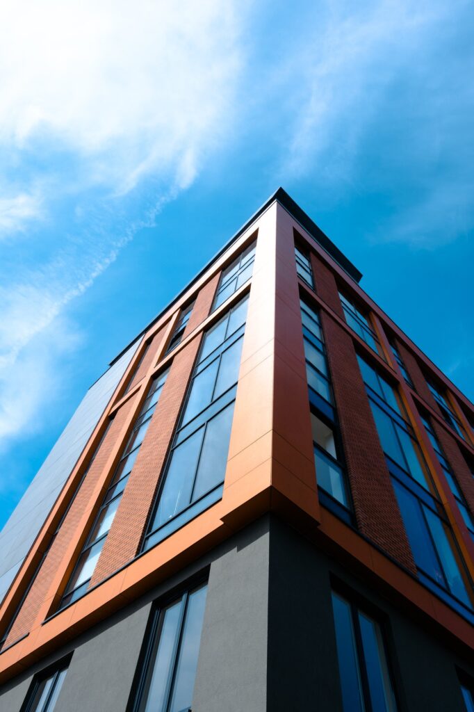 Modern building against clear blue sky vertical perspective