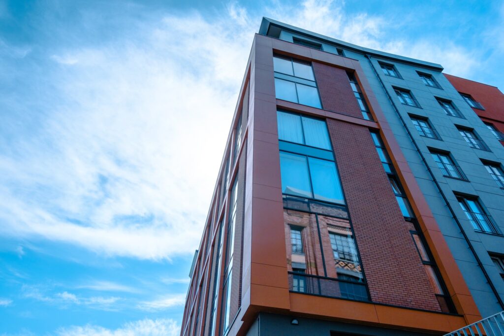 Modern urban building with large windows against blue sky