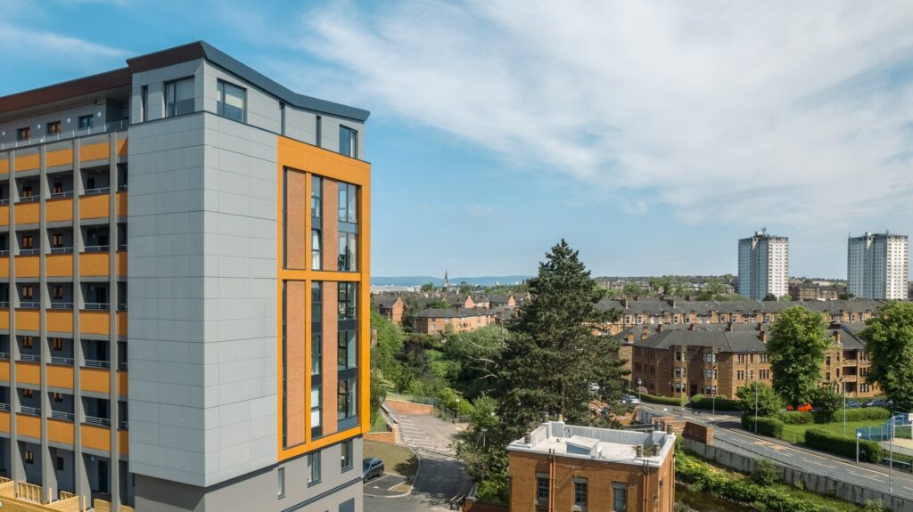 Modern urban landscape with tall buildings and clear blue sky