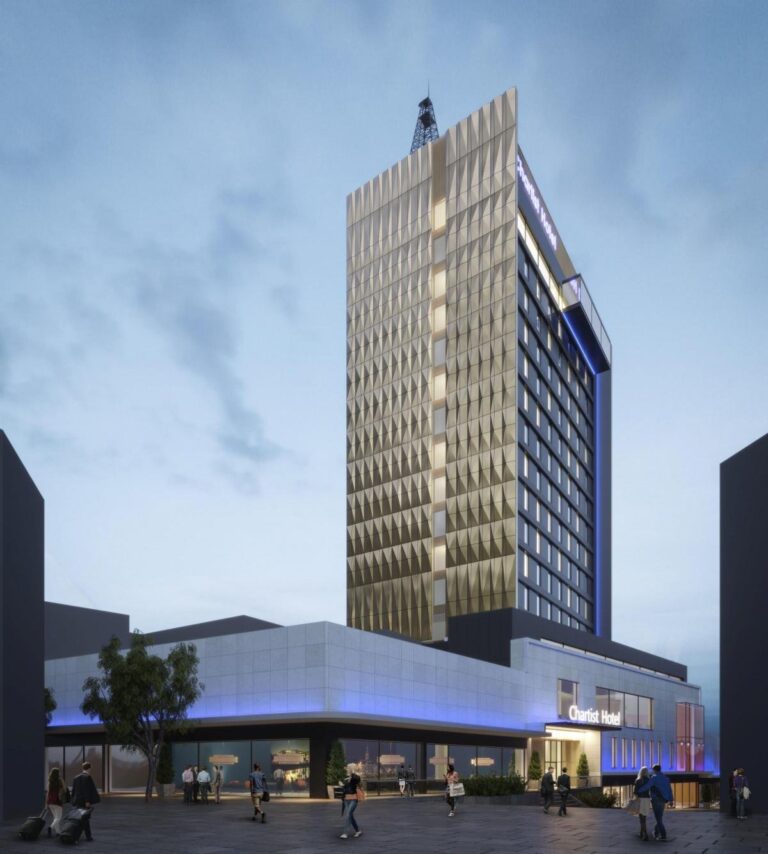Modern hotel building with tall architecture and evening lights