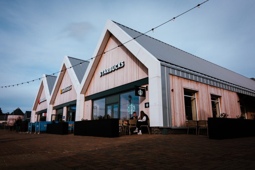 Modern coffee shop building with distinctive triangular roofs