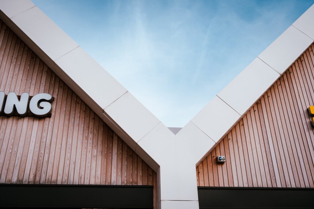 Modern building with wooden exterior and unique roof design