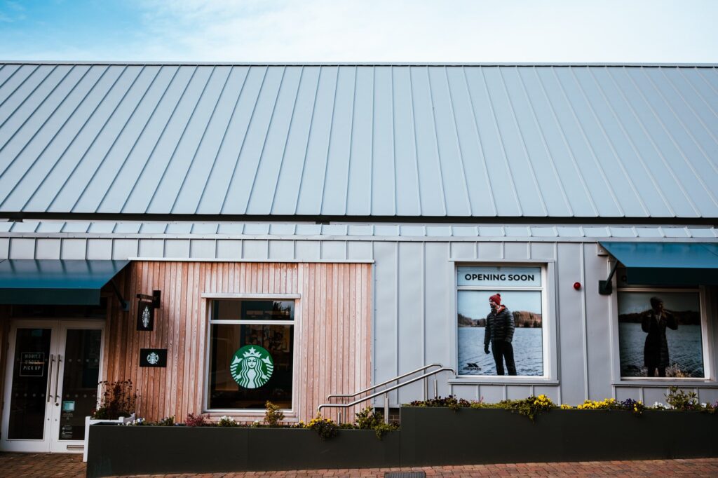 Exterior view of a Starbucks store with an opening soon sign